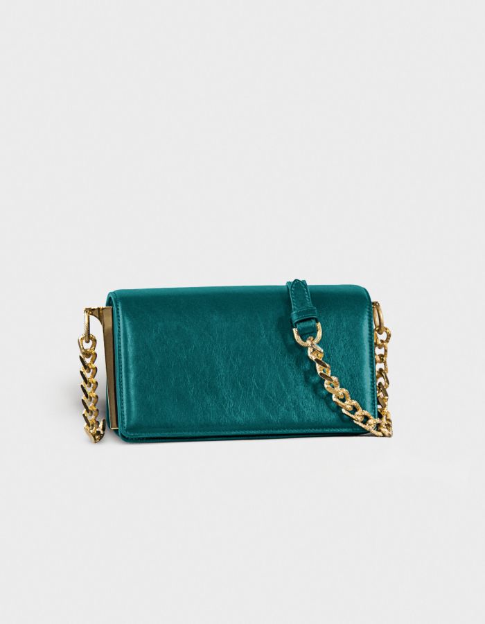 Teal velvet handbag with gold chain strap.
